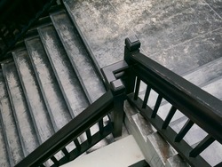top view of a stair with black wood railing