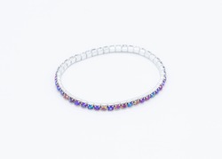 a metal bracelet made with multi colored  stones inset in silver metal settings