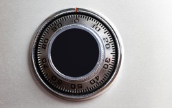 Closed up image of steel safe dial lock.