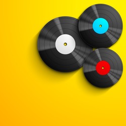 Musical concept with vinyl disc on yellow background.