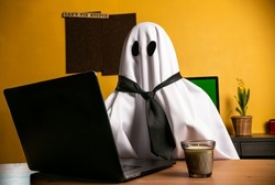 Ghost writing an article on laptop n home office with 