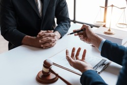 Lawyer and client sign variou financial legal contract to mediate with the legal execution department and make appointment for client to mediate debt settlement agreement.