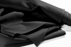Texture. Background. Pattern. Black fabric for cutting clothes. Excellent evening dress, great design