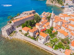 Aerophotography. View from flying drone. Panoramic cityscape of The Old Town of Budva, Montenegro. Top View. Beautiful destinations.