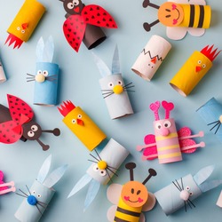 Happy easter kindergarten decoration concept - rabbit, chicken, egg, bee from toilet paper roll tube. Simple diy creative idea. Eco-friendly reuse recycle decor, daycare paper craft