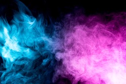 close up of colorful pink and blue steam smoke in mystical and fabulous forms on black background.Mocap for art