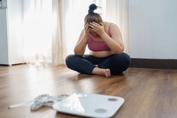 Obese Woman with fat upset about her belly. Overweight woman touching his fat belly and want to lose weight. Fat woman worried about weight diet lifestyle.