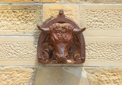 Cast iron Bulls Head Fountain on the northern wall of Berrima gaol. 1877. Water flowed from the mouth to a sandstone trough to water horses on court days. 