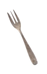 Beautiful old vintage fork isolated on white background. Top view. Retro silverware.