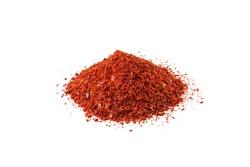 chilli pepper seedless flakes heap isolated on white background. Spices and food ingredients. in Korea known as Gochugaru. Used for Kimchi.