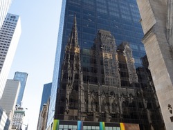A reflection of Saint Patrick's Cathedral in one of its surrounding buildings.