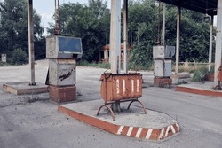 Abandoned Soviet LPG gas station. An old USSR liquefied petroleum gas station in the countryside.