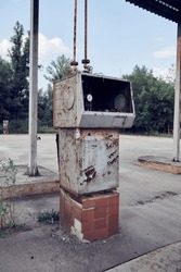 Abandoned Soviet LPG gas station. An old USSR liquefied petroleum gas station in the countryside. Vertical photo.