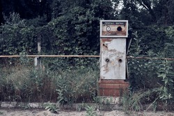 Abandoned Soviet LPG gas station. An old USSR liquefied petroleum gas station in the countryside. Horizontal photo. Translation of the inscription: Propane - butane.
