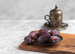 HURMA, Dates. Presentation of dried dates fruit with Turkish coffee.  Popular fruit of Ramadan.