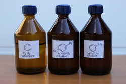 Organic solvents in dark glass bottles: benzene, p-xylene, toluene.