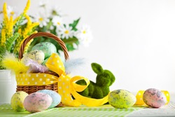 Happy Easter. Congratulatory easter background. Easter eggs and flowers. Background with space for copying. Selective focus.