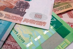 Background from Russian paper money. Banknote 5000 rubles. World financial crisis. Taxes and fees. Default in Russia. Living wage. Money to pay off a bank loan. Russia has printed new banknotes.