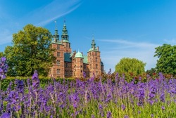 Copenhagen, Denmark. View of Rosenborg Castle with beautifull  lavender flowers in the garden at summer day.