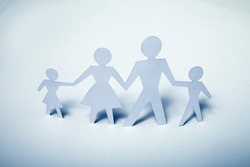 Concept image of paper cutout family
