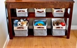 Simple easy storage baskets for living and bedroom toy clean up, neat and tidy small space living. Photo background, organization ideas, lifestyle.