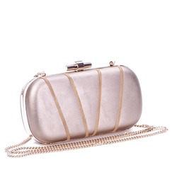 Elegant metallic leather long chain clutch bag for women, decorated with smaller golden metal chains. Luxury female accessories. Red carpet fashion. Retail, e-commerce store, boutique.