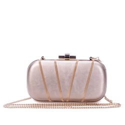 Elegant romantic metallic leather long chain clutch bag for women, decorated with smaller golden metal chains. Luxury female accessories. Red carpet fashion. Retail, e-commerce store, boutique.