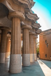 Columns stone aqueduct of a building designed by Gaudi in park Guel in Barcelona. High quality photo