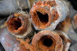 Plumbing pipes with limestone and rust