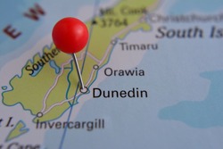 Pin marked Dunedin on map with red pin, New Zealand