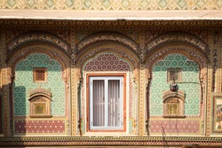 Stunning view of a colorful decoration around some windows in Jaipur, India. Jaipur is the capital  of Rajasthan, and the City Palace was the administrative seat of the Maharaja of Jaipur.