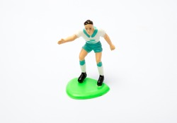 Football player toy on white background