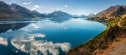 Panoramic view from Bennett's Bluff Lookout on one of the most scenic drives in New Zealand that connects Queenstown and Glenorchy and overlooks Pig and Pigeon Islands and Lake Wakatipu.