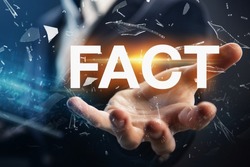 Hand of a businessman presenting the word fact. Facts, truth or accurate information in media news or business concept.