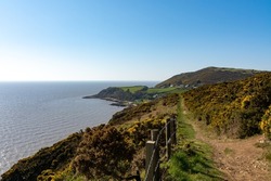 View from the coastal path along the Solway coas on a beautiful sunny spring dayt.  Sandyhills beach, Dumfries and Galloway, Scotland.