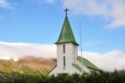 Church surrounded by mountains in Western Iceland