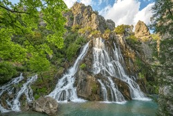 impressive view of Cündüre waterfall, which  is one of the biggest one around in Antalya and it springs out from many cracks and rifts on the face of the mountainous terrain, falling about 40 meters.