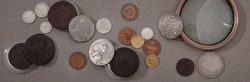 Numismatics. Old collectible coins of silver, gold and copper on the table. Top view.
