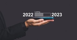 Countdown to 2023 concept. The virtual download bar with loading progress bar for New Year's Eve and changing the year 2022 to 2023.