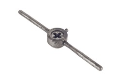 thread cutting tool, part of a thread cutting head from a metal key. threaded rod in a sharp steel cutting tool. metalworking