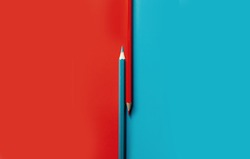 
contrasting image of colored pencils. opposition of red and blue. concept for office, school, writing