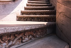 Intricately carved buddhist wooden stairs at the entrance of the Sanctuary of Truth in Pattaya, Thailand