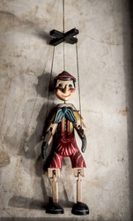 Selective Focus Abstract image of a Wooden String Puppet Boy