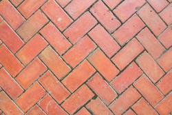 Flooring pattern with beautiful red clay tiles for walkway flooring. Top view and copy space