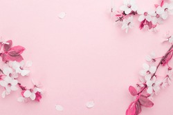Spring background table. May flowers and April floral nature on pink. For banner, branches of blossoming cherry against background. Dreamy romantic image, landscape panorama, copy space.