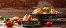 plate with delicious samosas on a wooden background copy space, Samosas, oriental uzbek cuisine, Central Asian cuisine. Popular indian or pakistani street food. banner