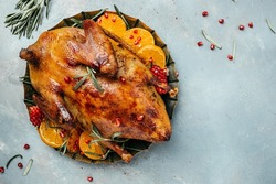 Roast duck with orange, rosemary, berry and spices. banner, menu, recipe place for text, top view.