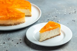cheesecake with peache jelly, jam. delicious sweet dessert piece of cheesecake. Homemade cream cake with peaches.