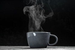 cup of coffee with steam on black background. Hot drink. hot steam with smoke, Culinary, cooking, concept.