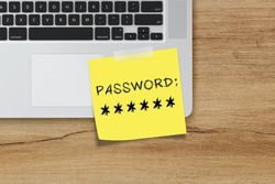 Password management, password writing on sticky note on laptop